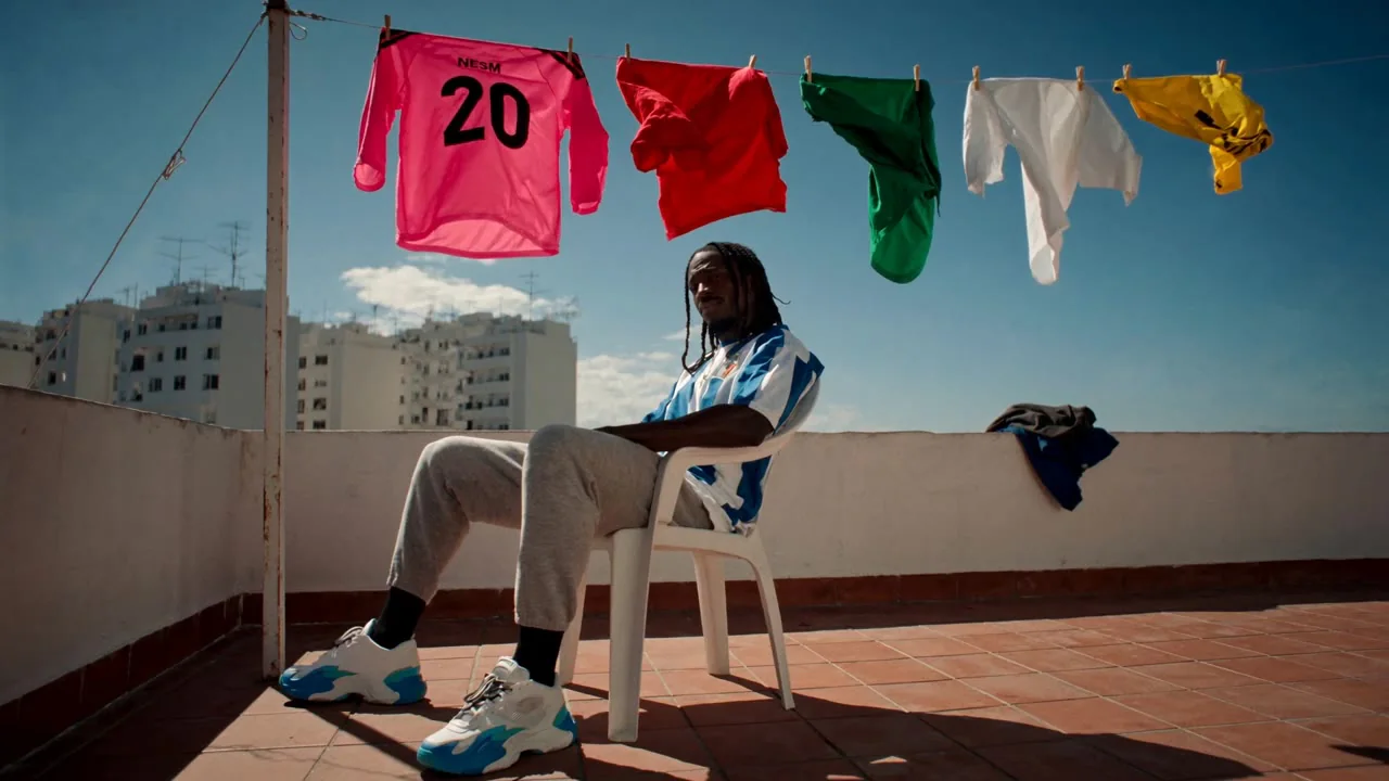 An editorial sportswear portrait on a rooftop